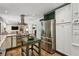 Spacious kitchen featuring stainless steel appliances, granite countertops, and a decorative island at 205 Glencourtney Dr, Sandy Springs, GA 30328