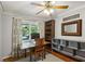 Bright home office featuring a wooden desk, shelving, decorative mirror, and neutral-toned walls at 205 Glencourtney Dr, Sandy Springs, GA 30328