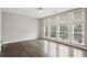 This bright bedroom showcases hardwood floors, large windows, and natural light at 269 Devin Ne Pl, Atlanta, GA 30305