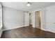 Bedroom featuring hardwood floors and multiple doors at 269 Devin Ne Pl, Atlanta, GA 30305