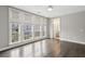 Bright bedroom featuring large windows, hardwood floors, and neutral paint at 269 Devin Ne Pl, Atlanta, GA 30305