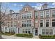 Brick townhome featuring black trim windows and dormer windows at 269 Devin Ne Pl, Atlanta, GA 30305