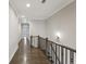 Hallway with wood floors, staircase, and white crown molding at 269 Devin Ne Pl, Atlanta, GA 30305