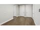 Hallway with beautiful hardwood floors and white doors adds to the home's interior appeal at 269 Devin Ne Pl, Atlanta, GA 30305
