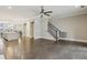 Open-concept living room with hardwood floors and access to the kitchen and dining room at 269 Devin Ne Pl, Atlanta, GA 30305