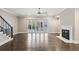 A spacious living room with a fireplace and sliding doors to a porch at 269 Devin Ne Pl, Atlanta, GA 30305