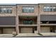 Exterior shot of brick condos with covered patios and garage parking at 269 Devin Ne Pl, Atlanta, GA 30305