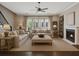 Cozy living room showcasing neutral tones, plush seating, a fireplace, and access to the outdoors at 269 Devin Ne Pl, Atlanta, GA 30305