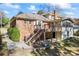 Exterior backyard view with a wood deck and stairs down to the patio at 5269 Wyntercreek Dr, Atlanta, GA 30338