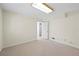 Unfinished basement space featuring carpet and a doorway at 5269 Wyntercreek Dr, Atlanta, GA 30338
