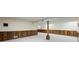 Basement space featuring carpet flooring, paneled walls and bright lighting at 5269 Wyntercreek Dr, Atlanta, GA 30338