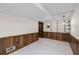 Spacious basement featuring paneled walls, neutral carpet and shelving at 5269 Wyntercreek Dr, Atlanta, GA 30338