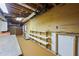 Basement space with exposed ceiling, storage, and workbench areas at 5269 Wyntercreek Dr, Atlanta, GA 30338
