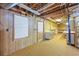 Unfinished basement space with a workbench area and exposed ceiling at 5269 Wyntercreek Dr, Atlanta, GA 30338