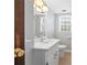 Bright bathroom with a white vanity, white toilet and tiled floor at 5269 Wyntercreek Dr, Atlanta, GA 30338