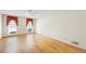 Spacious bedroom with hardwood floors, ceiling fan, crown molding, and natural light from two windows at 5269 Wyntercreek Dr, Atlanta, GA 30338