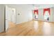 Bedroom with hardwood floors, crown molding, ceiling fan, and two windows with decorative curtains at 5269 Wyntercreek Dr, Atlanta, GA 30338