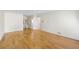 Bedroom with hardwood floors, an open doorway to a vanity, and a ceiling fan at 5269 Wyntercreek Dr, Atlanta, GA 30338