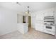 Bright kitchen with tile floor, white cabinets and vintage stove at 5269 Wyntercreek Dr, Atlanta, GA 30338