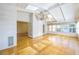 Bright sunroom with hardwood floors, a chandelier, skylights, and many windows overlooking the property at 5269 Wyntercreek Dr, Atlanta, GA 30338