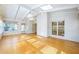 Sunroom with hardwood floors, many windows, skylights, and a door that leads to the home's exterior at 5269 Wyntercreek Dr, Atlanta, GA 30338