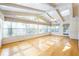 Sunroom with hardwood floors, many windows, and a door that leads to the home's exterior at 5269 Wyntercreek Dr, Atlanta, GA 30338