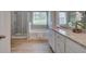 Elegant bathroom with a separate shower and tub, and granite countertops, offering a spa-like experience at 1079 Georgian Point Dr, Lawrenceville, GA 30045