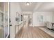 Bright entryway with wood floors, modern decor, and open access to other rooms at 1079 Georgian Point Dr, Lawrenceville, GA 30045