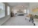 Large main bedroom with vaulted ceiling, lots of natural light, and a cozy sitting area that offer relaxation and comfort at 1079 Georgian Point Dr, Lawrenceville, GA 30045