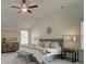 Bright and spacious main bedroom features vaulted ceilings, multiple windows, neutral decor, and calming natural light at 1079 Georgian Point Dr, Lawrenceville, GA 30045