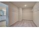 Spacious walk-in closet with plenty of shelving and rod space for organized storage and easy access to belongings at 1079 Georgian Point Dr, Lawrenceville, GA 30045