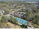 Aerial photograph showing community tennis and swimming pool with mature trees at 1228 Church St, Decatur, GA 30030