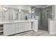 Modern bathroom featuring double sinks, ample counter space, and a glass-enclosed shower at 1228 Church St, Decatur, GA 30030