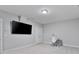 Bonus room with big TV, carpet, neutral paint and baseboards, task chair and desk at 1228 Church St, Decatur, GA 30030