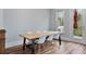 Dining area with modern chairs, wood table, and natural light from the nearby window at 1228 Church St, Decatur, GA 30030