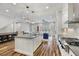 Well-lit kitchen showcasing stainless steel appliances and an expansive central island at 1228 Church St, Decatur, GA 30030