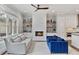 Inviting living room featuring a fireplace, a ceiling fan, and comfortable seating at 1228 Church St, Decatur, GA 30030
