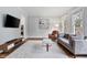 Well-lit living room offering hardwood floors and neutral color palette, perfect for relaxing at 1228 Church St, Decatur, GA 30030