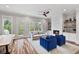 Bright living room with hardwood floors, a fireplace, and access to the outdoors at 1228 Church St, Decatur, GA 30030