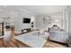 Open-concept living room featuring hardwood floors and stylish decor and furnishings at 1228 Church St, Decatur, GA 30030