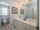Bright bathroom features a double sink vanity, large mirror, and separate toilet area at 1871 Shiloh Valley Nw Way, Kennesaw, GA 30144