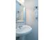 Cozy powder room with decorative sink and faucet, mirror, towel rack, and neutral paint at 1871 Shiloh Valley Nw Way, Kennesaw, GA 30144
