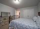 Comfortable bedroom with neutral colored walls, carpet, white trim, and large closet at 1871 Shiloh Valley Nw Way, Kennesaw, GA 30144