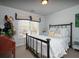 Cozy bedroom features a comfortable bed with decorative pillows and lots of natural light at 1871 Shiloh Valley Nw Way, Kennesaw, GA 30144