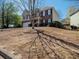 Charming two-story home with a brick facade, attached garage, and well-manicured front yard at 1871 Shiloh Valley Nw Way, Kennesaw, GA 30144