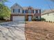 Charming two-story brick home with a well-manicured lawn, attached garage, and inviting front entrance at 1871 Shiloh Valley Nw Way, Kennesaw, GA 30144