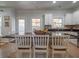 Bright kitchen featuring white cabinetry, granite countertops, an island with barstool seating, and modern appliances at 1871 Shiloh Valley Nw Way, Kennesaw, GA 30144