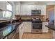 Kitchen featuring white cabinetry, granite countertops, stainless steel appliances, and tile backsplash at 1871 Shiloh Valley Nw Way, Kennesaw, GA 30144