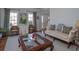 Inviting living room with hardwood floors, large windows, neutral paint, and an abundance of natural light at 1871 Shiloh Valley Nw Way, Kennesaw, GA 30144