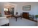 Open concept living room flows into dining area with beautiful hardwood floors and calming wall art at 1871 Shiloh Valley Nw Way, Kennesaw, GA 30144